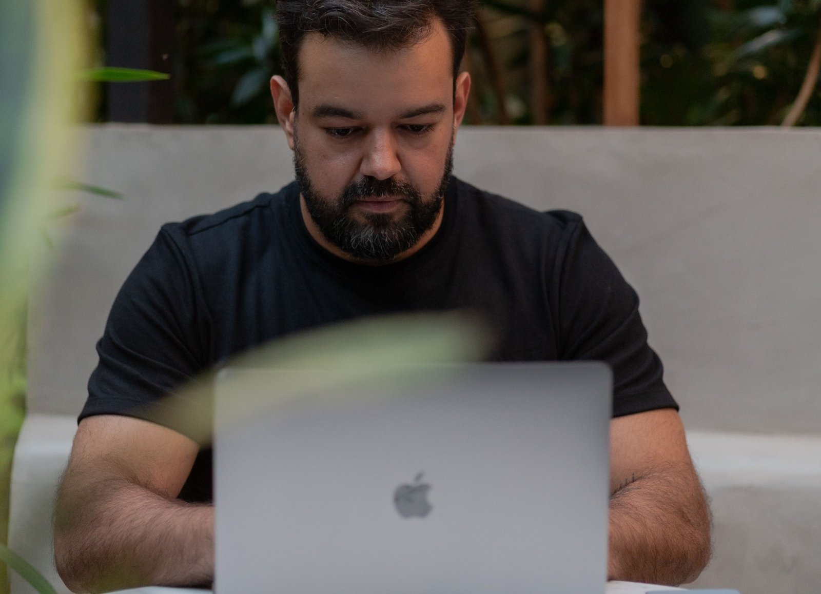 Freelancer working on a laptop at a café table